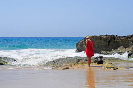 Girl walking on the beach in in Porto Santo