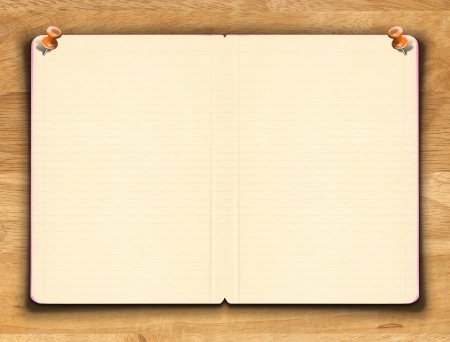 Blank notebook paper with line on the wooden backgroundの写真素材