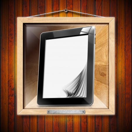 Black tablet computer with blank pages on wooden frameの写真素材