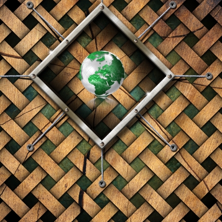 Terrestrial globe in the metal frame on the grunge background の写真素材