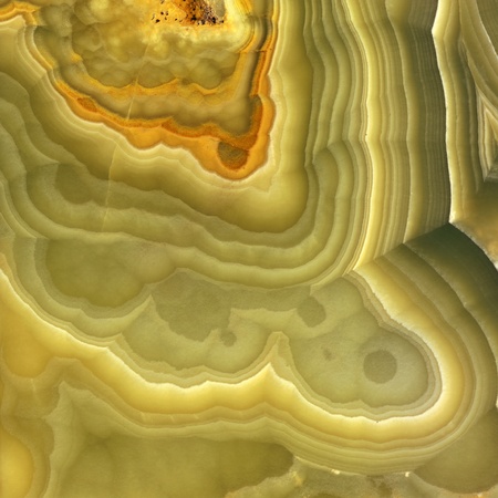 Magnified image details of a layer of onyx, green, yellow and orangeの写真素材