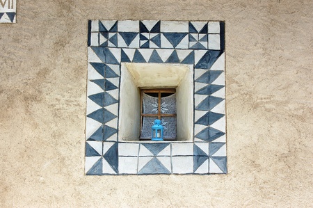 Detail of a typical window with decorations in Zuoz, Engadine Switzerlandの写真素材