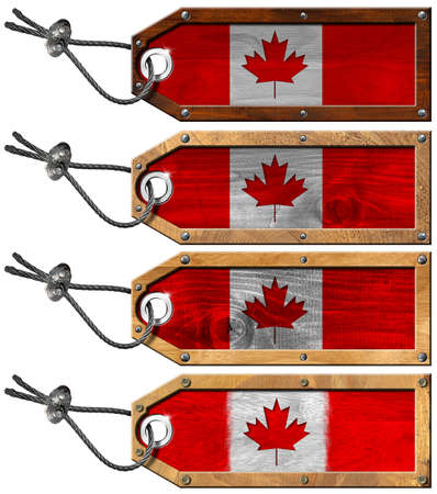 Four grunge wooden tags with Canada flags, steel cable and metal rivetsの写真素材