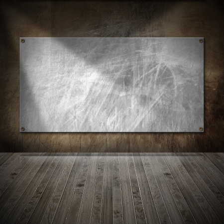 Brown metallic and wooden grunge interior with empty frameの写真素材