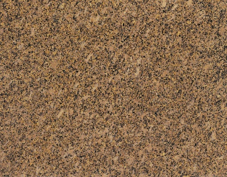 Surface of the granite with yellow, brown and black tint for backgroundの写真素材