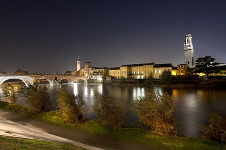 Ponte Pietra the oldest monument in Verona - Italy, and the river Adigeの写真素材