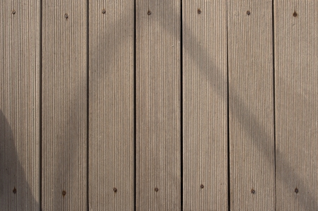 Grunge wooden background with seven brown boards and rusty screwsの写真素材