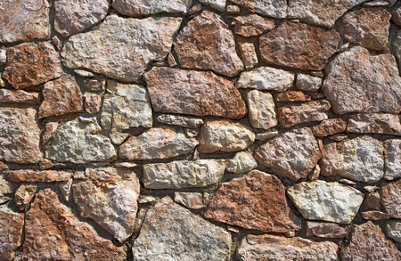 An old brown stone wall makes an excellent backgroundの写真素材