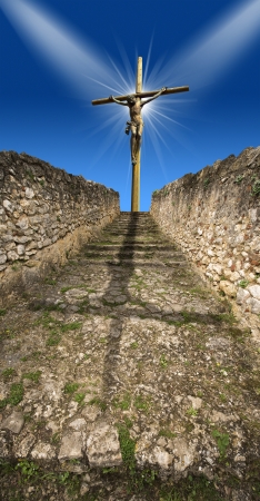 Crucifixion of Christ at the end of the path - symbol of God's on blue skyの写真素材