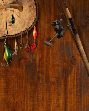 Wooden background with fishing tackle and knifeの写真素材