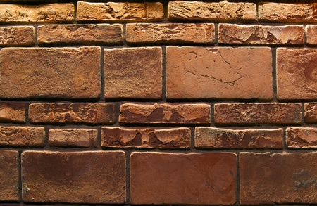 Wall for background texture with damaged brown bricksの写真素材
