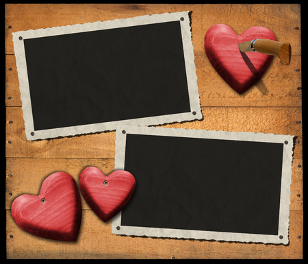Two aged and romantic photo frames on wooden with red hearts and folding knifeの写真素材