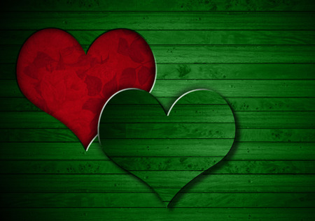 Green wooden wall with a hole in the shape of heart and red velvet background with roses flowersの写真素材