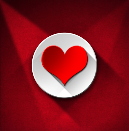 Stylized red heart with white circle on red velvet background with shadowsの写真素材