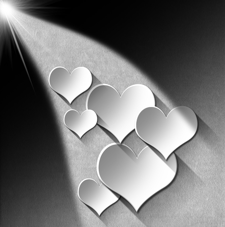 Many stylized white hearts on gray velvet background with shadowsの写真素材