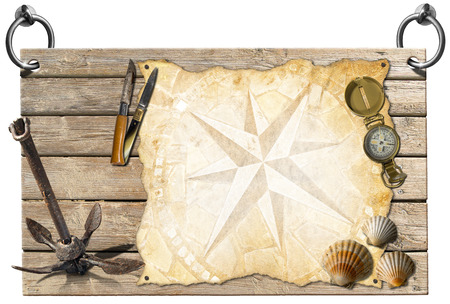 Wooden signboard with compass rose on a parchment, seashells, compass, folding knives, and old rusty anchor, concept of adventure travelの写真素材
