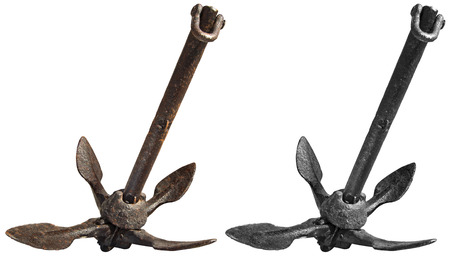 Old small rusty anchor for a small boat isolated on white background  folding grapnel anchor の写真素材