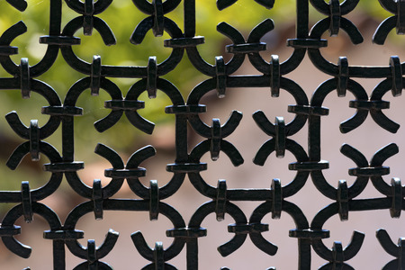 Silhouette of an old wrought iron fence painted with black colorの写真素材