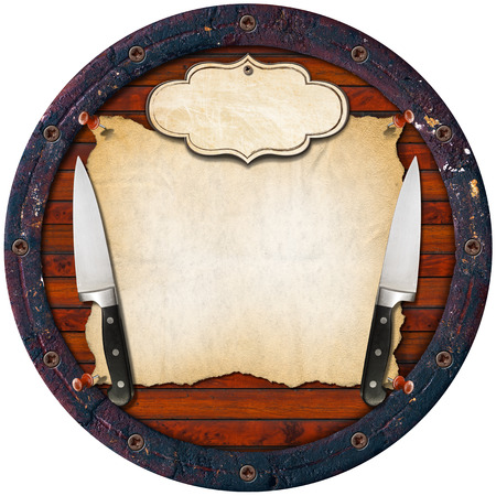 Wooden background (Bottom of a barrel) with two kitchen knives, empty parchment and label. Background for a rustic menuの写真素材