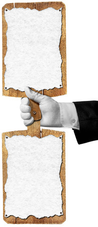 Hand of waiter with white glove holding two wooden cutting boards with empty sheet of paperの写真素材