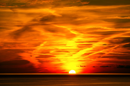 Beautiful sunset over the sea with cloudy sky. Cinque terre, Liguria, Italy, UNESCO world heritage siteの写真素材