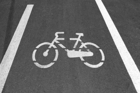 White markings representing a bicycle in a route reserved for bikesの写真素材