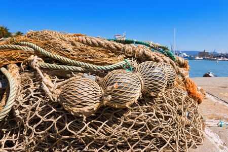 Fishing nets with ropes and floats in the harbor. La Spezia, Liguria, Italy