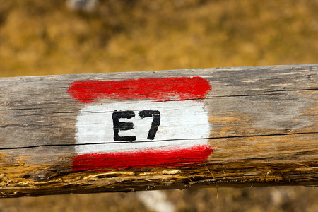 European Trail Sign E7 Lisbon Portugal - Constance Lake Romania on a wooden poleの写真素材