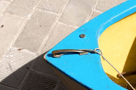 Detail of a wooden blue prow of a rowing boat moored on pier. Liguria, Italyの写真素材