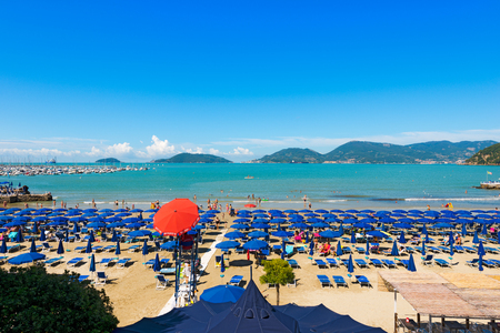 LERICI, ITALY - JULY 10, 2014: The Lido di Lerici beach, crowded with bathers on a sunny day in july. Beach near the village of Lerici in the Gulf of La Spezia, Liguria Italyのeditorial素材