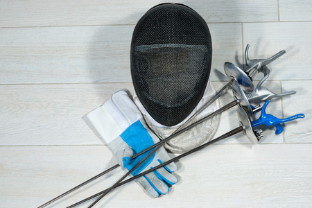 Fencing foil equipment. Three fencing foils with pistol grip (sporting weapon), a fencing mask and a...