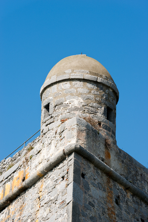 Detail of the Doria Castle (1164-XIX century) with a sentry box on a clear blue sky, in Portovenere town (UNESCO world heritage site), Liguria, Italyのeditorial素材