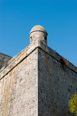 Detail of the Doria Castle (1164-XIX century) with a sentry box on a clear blue sky, in Portovenere town (UNESCO world heritage site), Liguria, Italyのeditorial素材