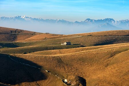 Plateau of Lessinia, Regional Natural Park of Lessinia, Veneto, Verona, Italy. In the background the Italian Alps (Adamello, Presanella and Brenta)のeditorial素材