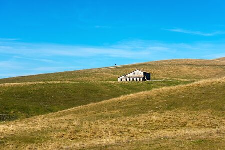 Typical farm house abandoned (Malga) in the plateau of Lessinia for the breeding of cows, Prealps of Veneto, Verona, Italyのeditorial素材