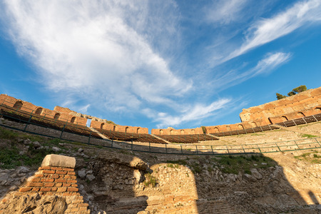 Ancient Greek Roman theater at sunset in Taormina town, Messina, Sicily island, Italy (II century...