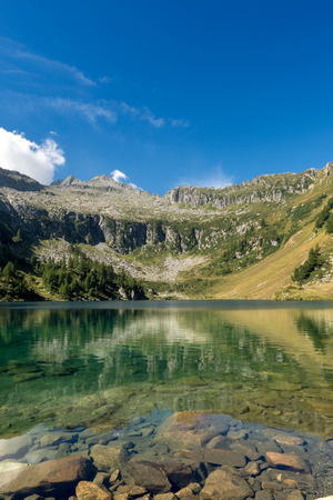 Campo Lake (Lago di Campo 1944 m.) In the National Park of Adamello Brenta.In the background the peak of Re di Castello - Trentino Alto Adige - Italy - Europeの写真素材