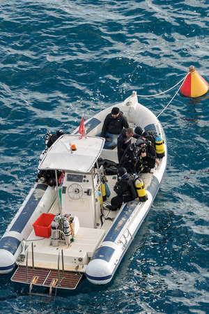 PORTOFINO, ITALY - DECEMBER 9, 2016: A group of divers on inflatable boat get ready for a dive in...