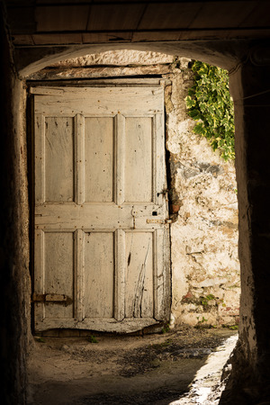 Old white wooden door of a country house. Apuan Alps, Tuscany, Italyの写真素材