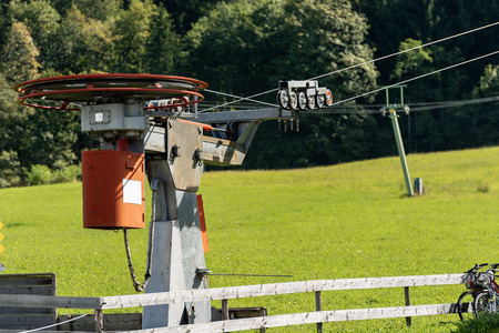 Close-up of an old ski lift in Germany at summer with green meadow (no snow)