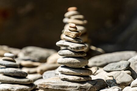 Close-up of a pile of stones in balance, Zen concept. Vernazza, Liguria, Italy