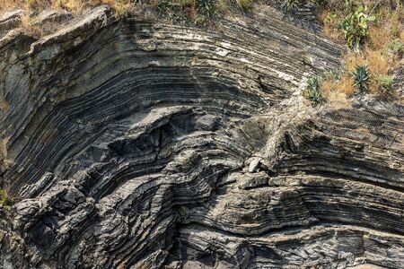 Close-up of a rocky cliff in Vernazza village, Cinque Terre National Park, UNESCO world heritage site. La Spezia province, Liguria, Italy, Europeの写真素材