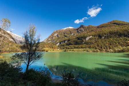 Lago di Tenno, small and beautiful lake in Italian alps (Monte Misone), Trento province,...