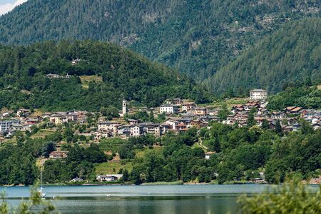 Small village of Ischia and the lake of Caldonazzo, Italian Alps, Valsugana valley, Trento province, Trentino-Alto Adige, Italy, Europeの写真素材