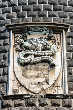 Detail of the Sforza Castle (Castello Sforzesco) with the coat of arms of the noble family of the Visconti with a snake that swallows a human (Biscione). Milan, Lombardy, Italy, Europeのeditorial素材