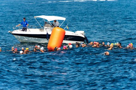 TELLARO, GULF OF LA SPEZIA, LIGURIA, ITALY - JULY 21th, 2019: Swimming competition in the Mediterranean sea (Trofeo del Gro), a group of athletes is ready for the startのeditorial素材