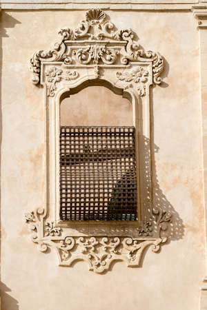Close-up of an ancient window with baroque decorations in Noto town, Sicily island, Italy, Europeのeditorial素材