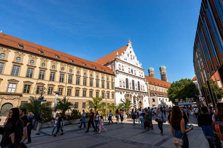 MUNICH, GERMANY - SEPT 6, 2018: Tourists and locals walking in the Neuhauser Strasse, largest pedestrian zone in Munich downtown. In the center, the church of St. Michael the Archangel, Michaelskircheのeditorial素材