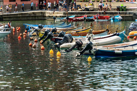 VERNAZZA, LIGURIA, ITALY - JULY 22, 2019: Port of the Ancient Vernazza village with small boats. Cinque Terre, National park in Liguria, La Spezia, Italy, Europe. UNESCO world heritage siteのeditorial素材