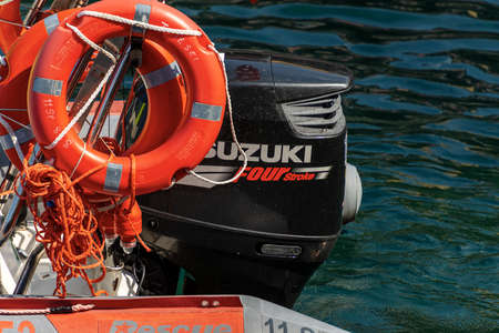 GULF OF LA SPEZIA, LIGURIA, ITALY - JULY 21, 2019: close-up of a water ambulance, small motor boat for emergency first aid with orange lifebuoys and Four stroke Suzuki engine. Italy, Europeのeditorial素材